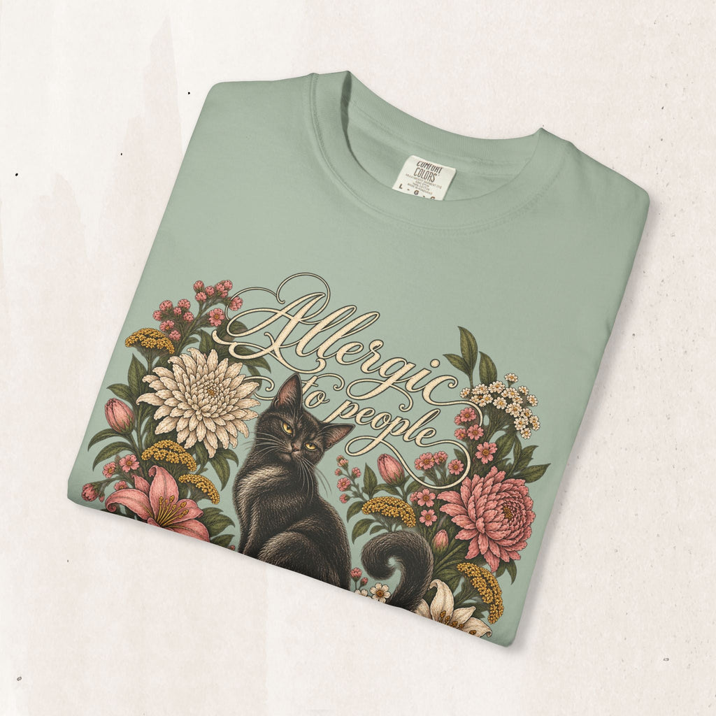 Wicked Thread Society sage green t-shirt featuring a black cat illustration surrounded by a vintage floral wreath.