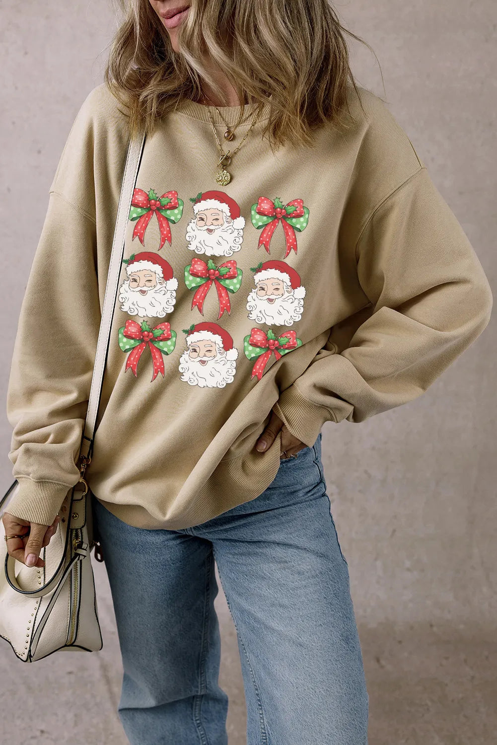 Wicked Thread Society beige long sleeve sweatshirt with a festive Santa Claus and green bow graphic print