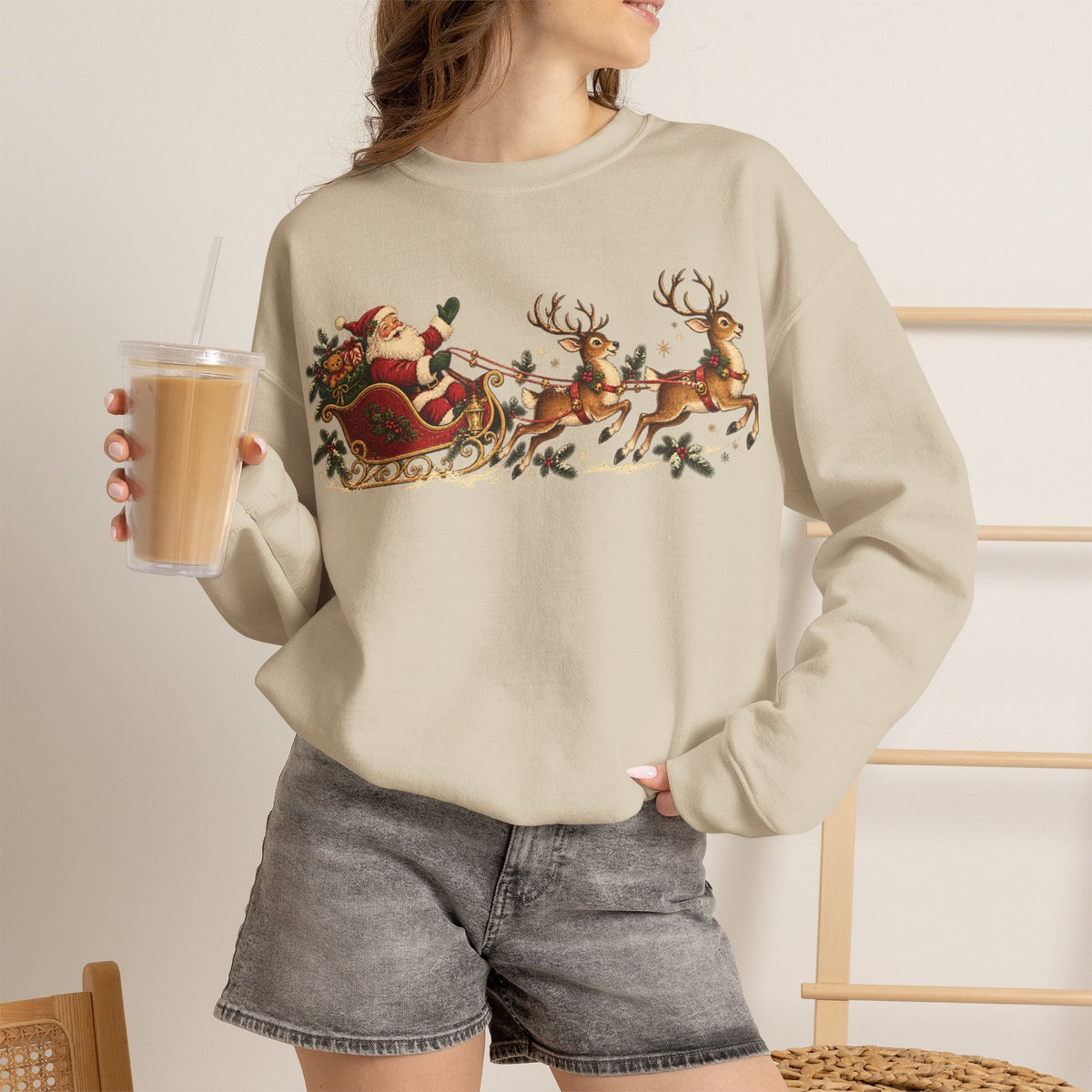 Wicked Thread Society beige crewneck sweatshirt featuring a vintage Santa and reindeer sleigh print on a woman.
