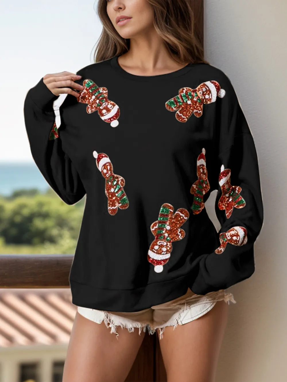 Wicked Thread Society black long sleeve sweatshirt featuring festive sequin gingerbread man patterns for the holidays