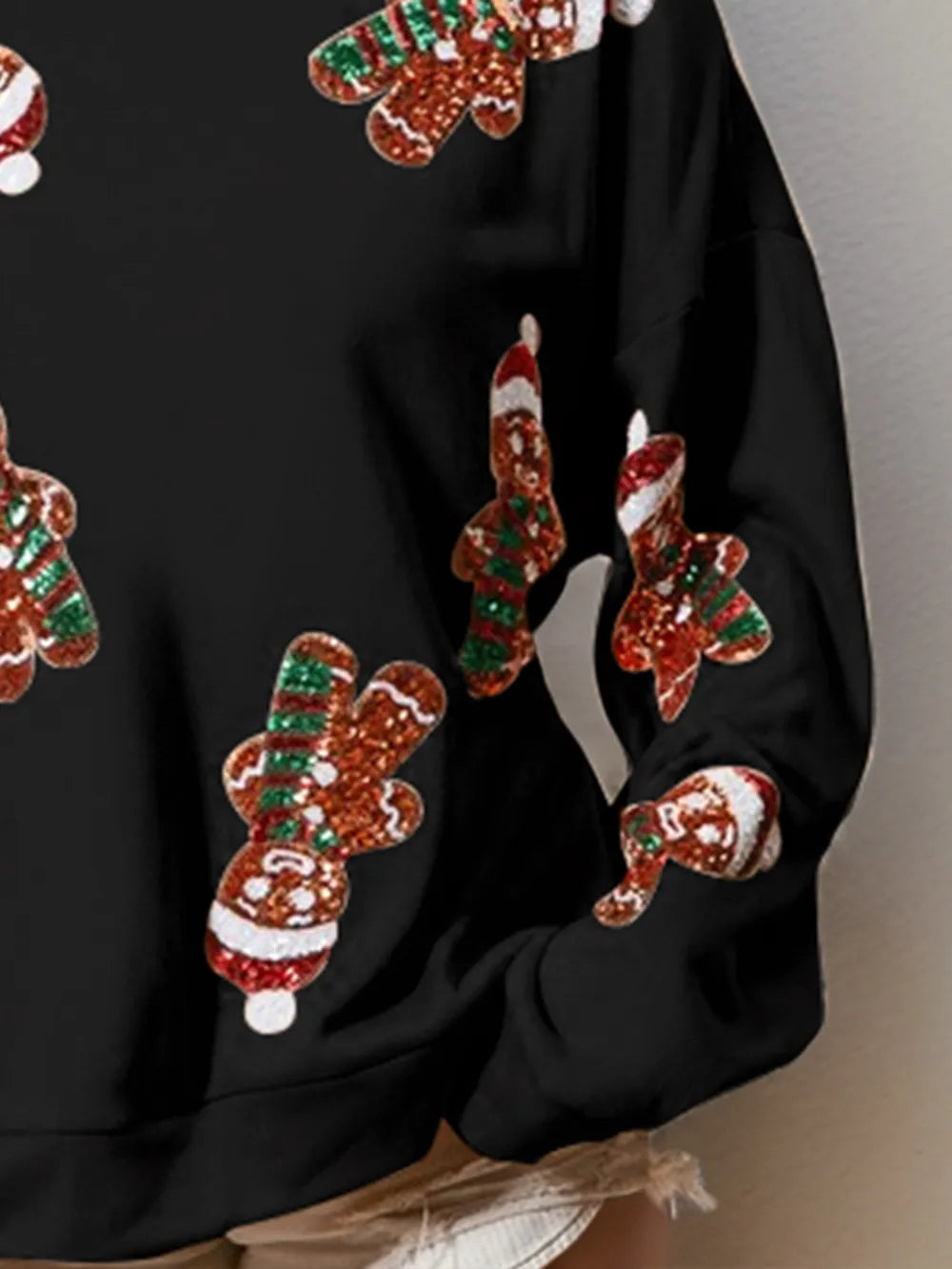 Wicked Thread Society black long sleeve sweatshirt featuring festive sequin gingerbread man holiday patterns