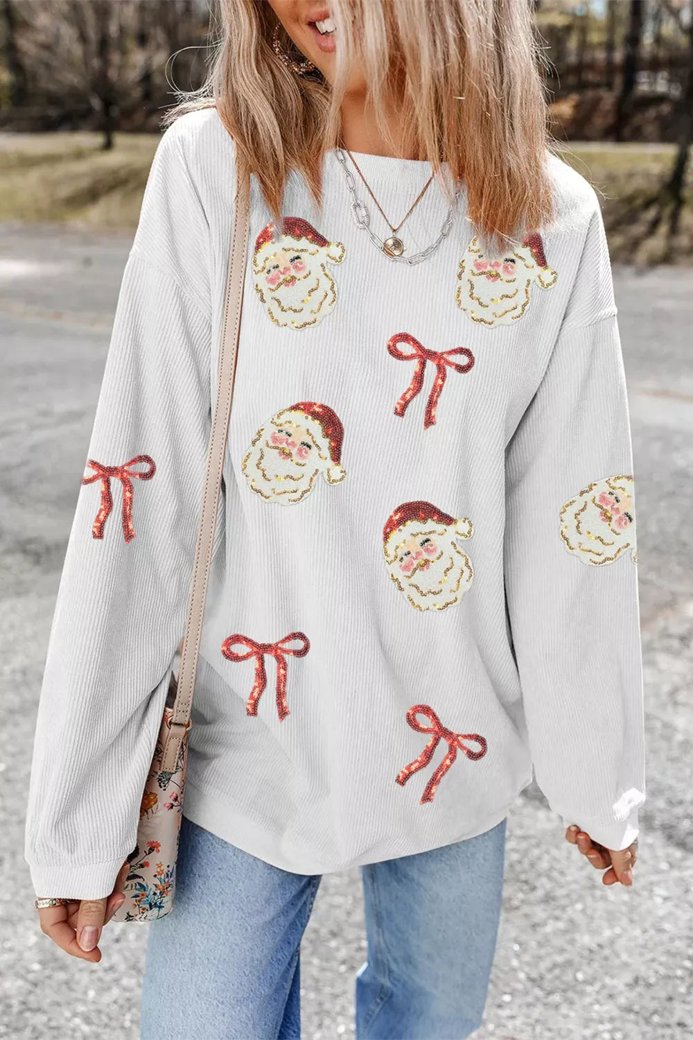 Wicked Thread Society white corded rib sweatshirt featuring festive sequin Santa face and red bow patches