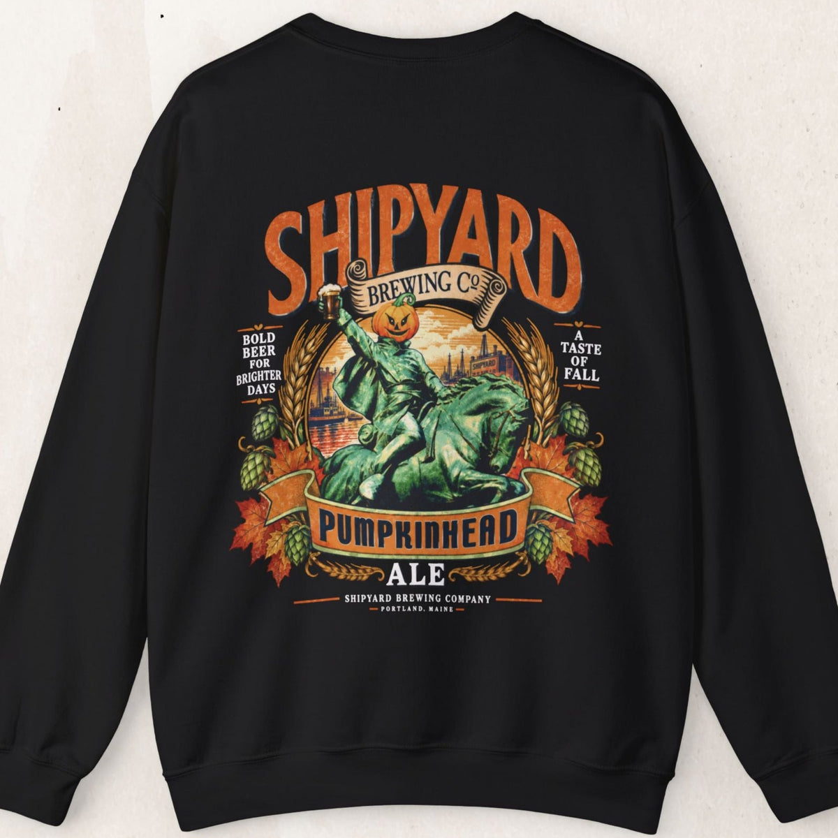 Wicked Thread Society black crewneck sweatshirt featuring a vintage Shipyard Pumpkinhead Ale graphic on the back.