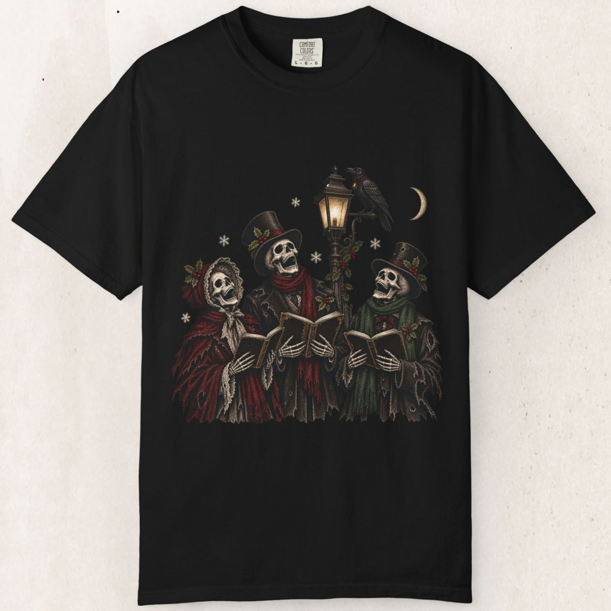 Wicked Thread Society black heavyweight cotton t-shirt featuring a graphic of three skeleton carolers under a lamppost.