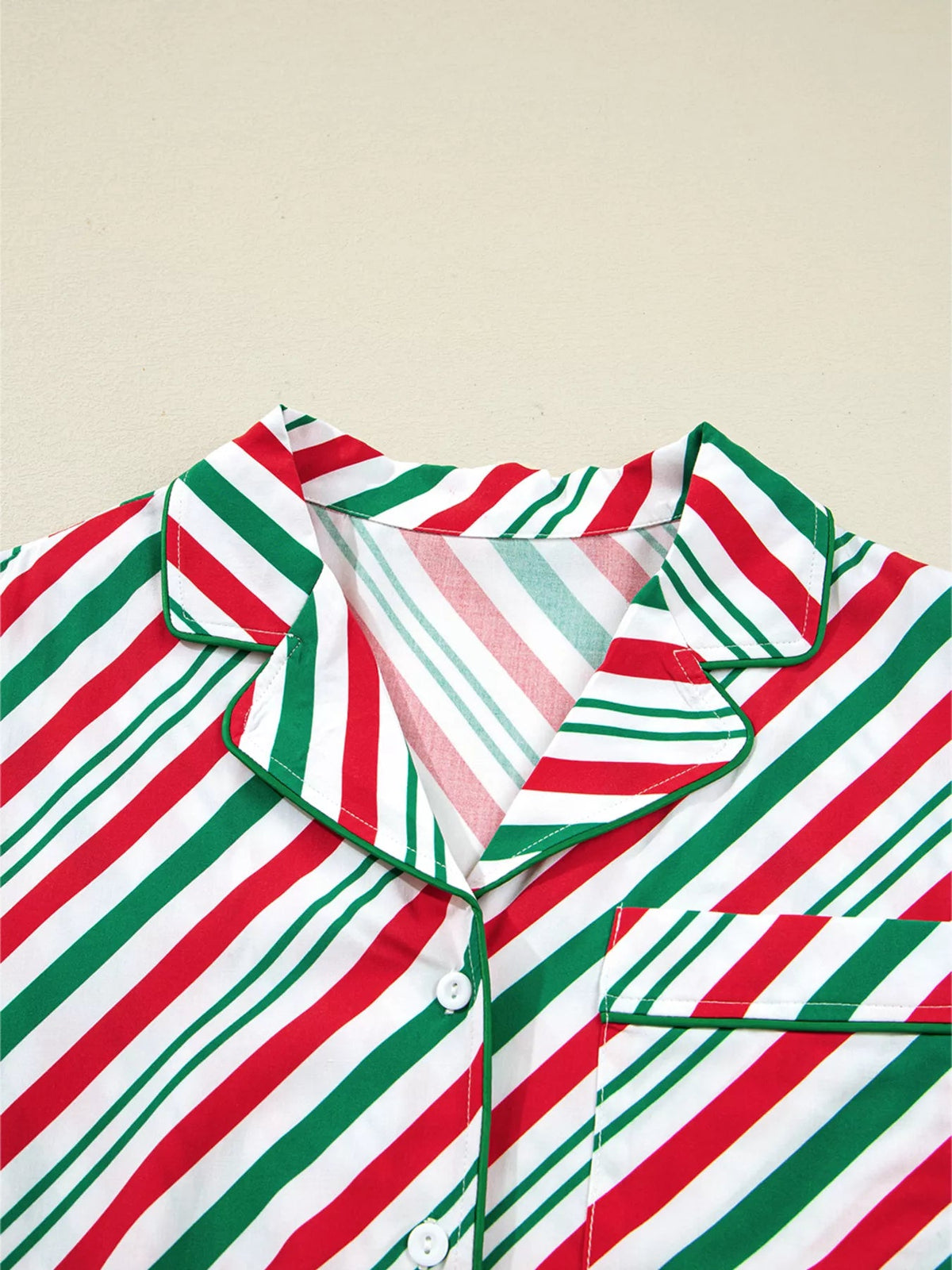 Wicked Thread Society two-piece Christmas pajama set featuring a red, white, and green diagonal striped viscose top.