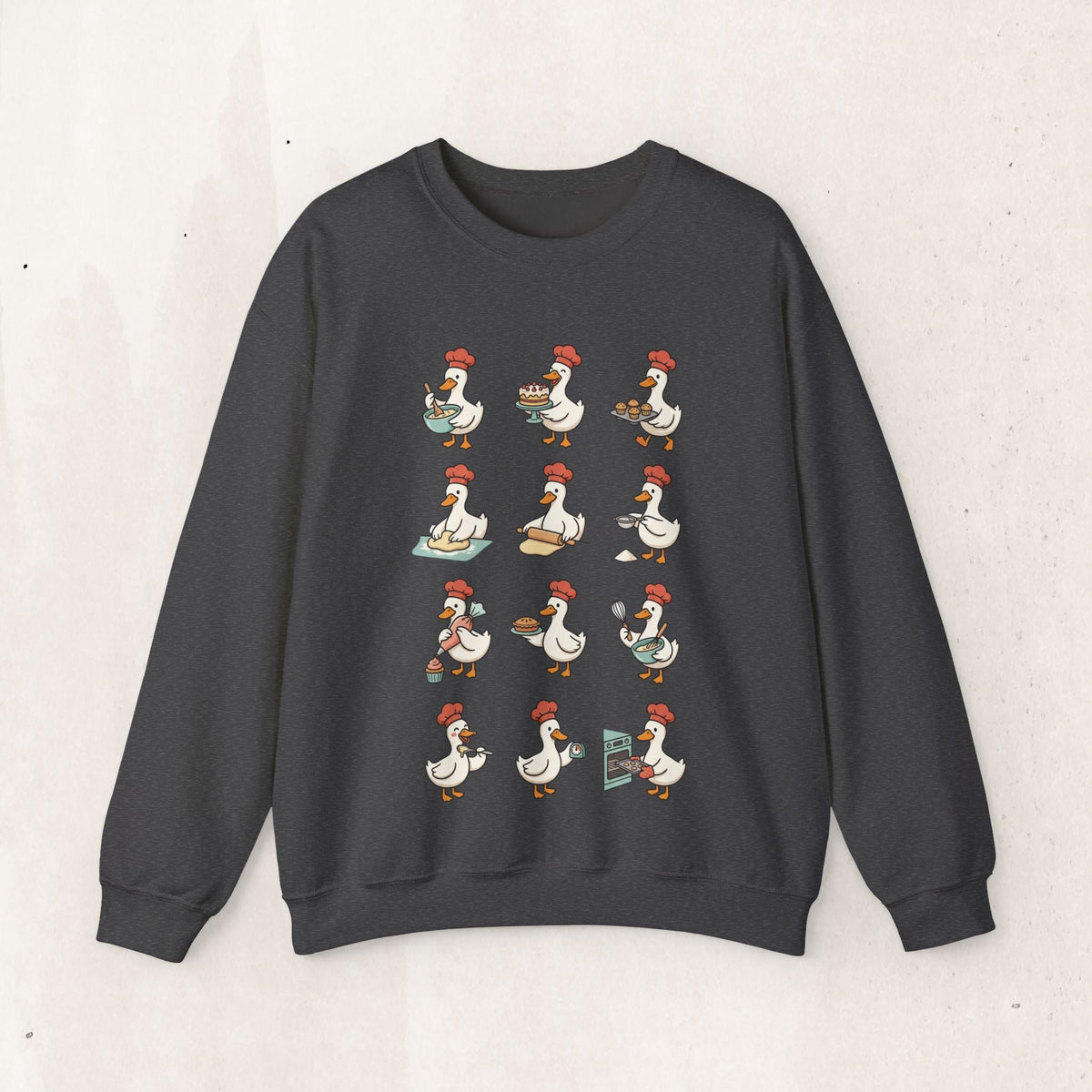 Wicked Thread Society charcoal grey crewneck sweatshirt featuring a whimsical print of geese baking holiday treats.