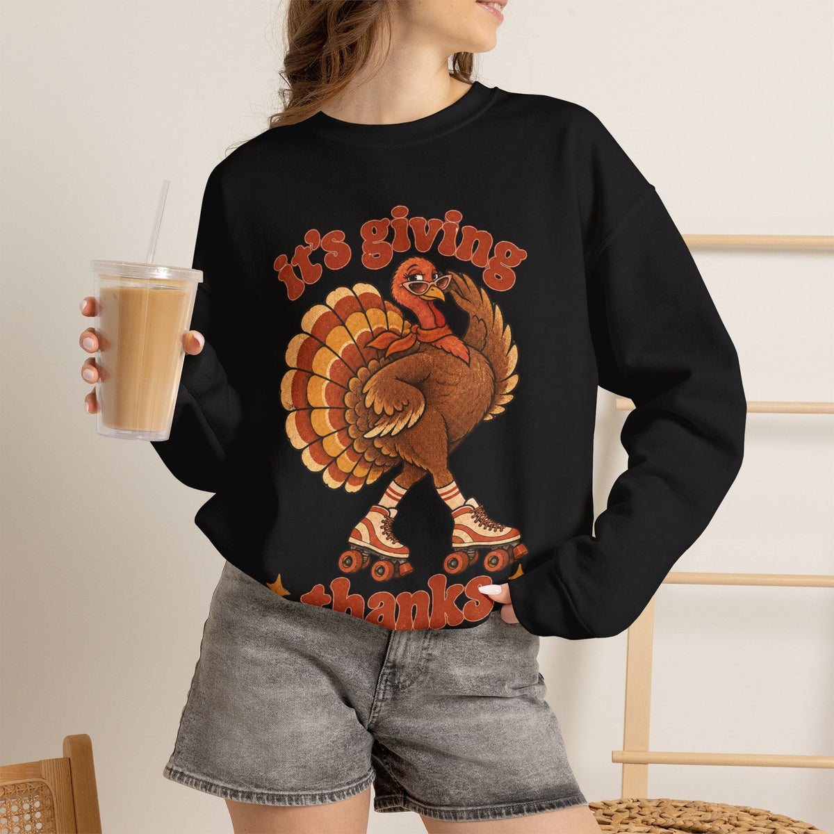 Wicked Thread Society black crewneck sweatshirt featuring a retro roller-skating turkey graphic for Thanksgiving.
