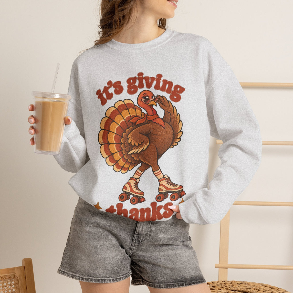 Wicked Thread Society grey crewneck sweatshirt featuring a retro roller-skating turkey graphic for Thanksgiving.