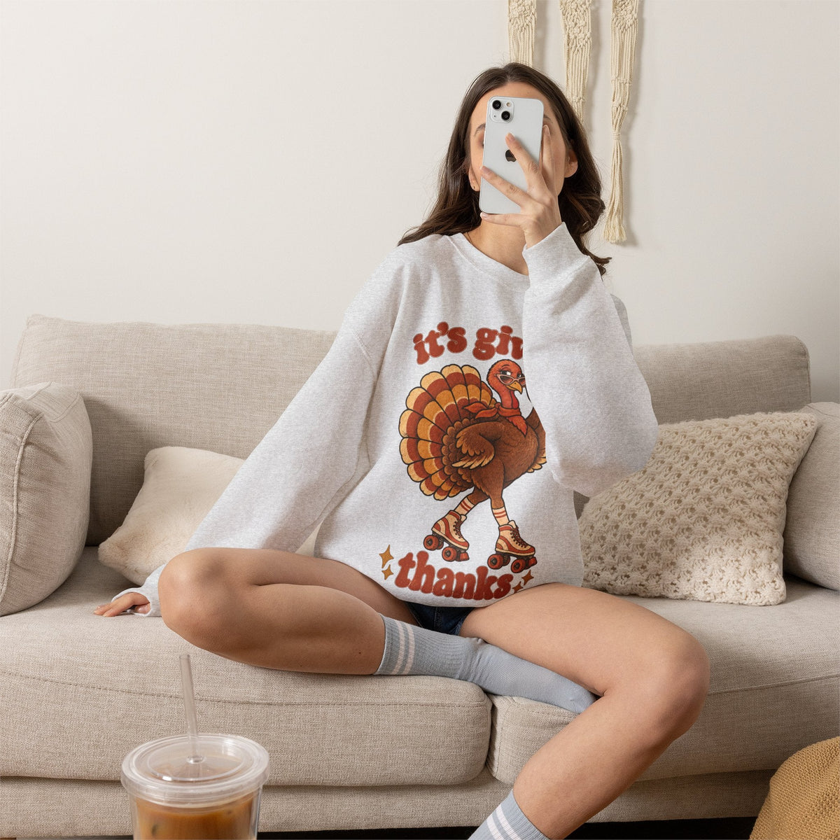 Wicked Thread Society grey crewneck sweatshirt featuring a retro roller-skating turkey graphic for Thanksgiving.