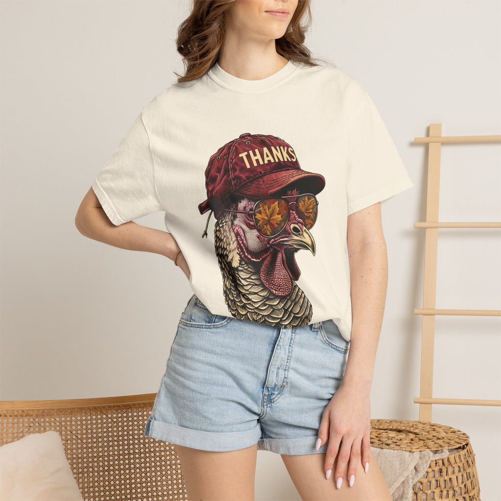 Wicked Thread Society cream t-shirt featuring a turkey wearing a red baseball cap and sunglasses with autumn leaves.