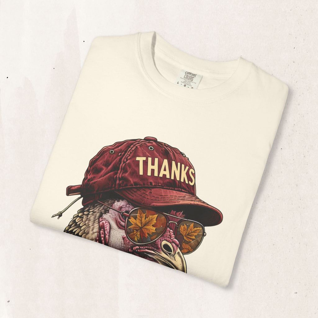 Wicked Thread Society cream t-shirt featuring a graphic of a turkey wearing a red baseball cap and sunglasses.