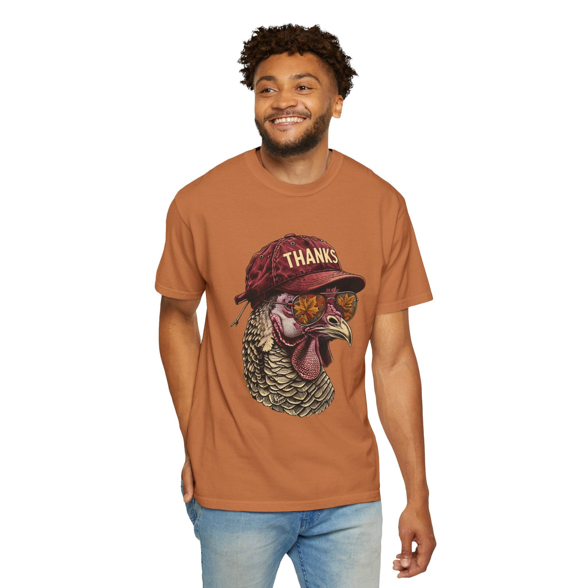 A man wearing a Wicked Thread Society Thanksgiving Turkey Tee in rust orange with a turkey graphic in sunglasses.