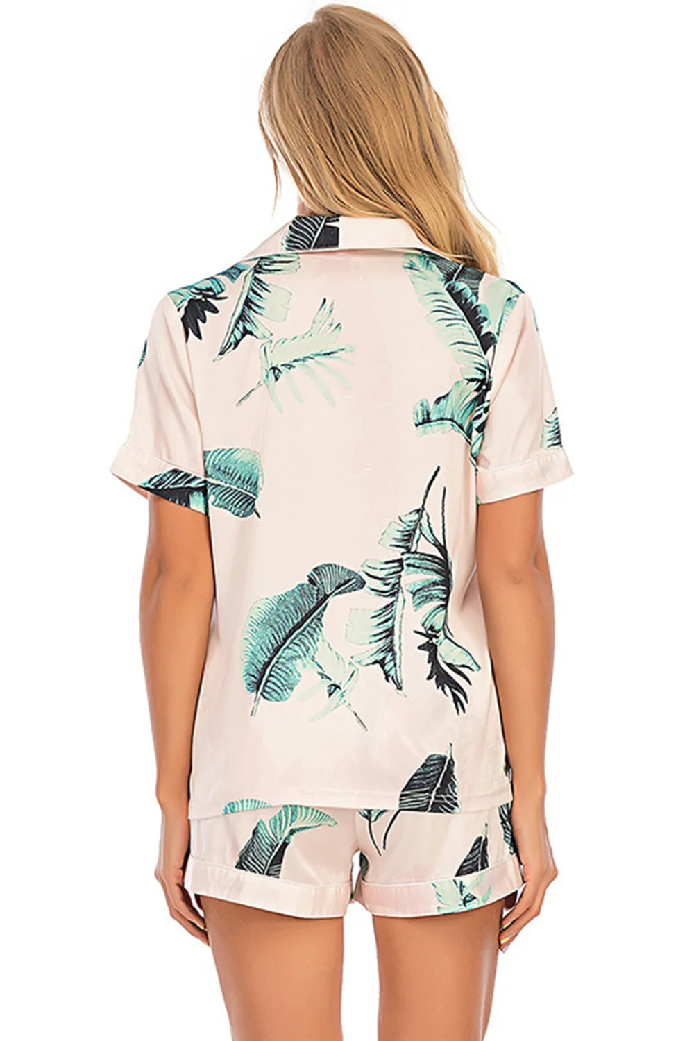 Wicked Thread Society two-piece lounge set featuring a pink button-up top and shorts with a tropical leaf print.