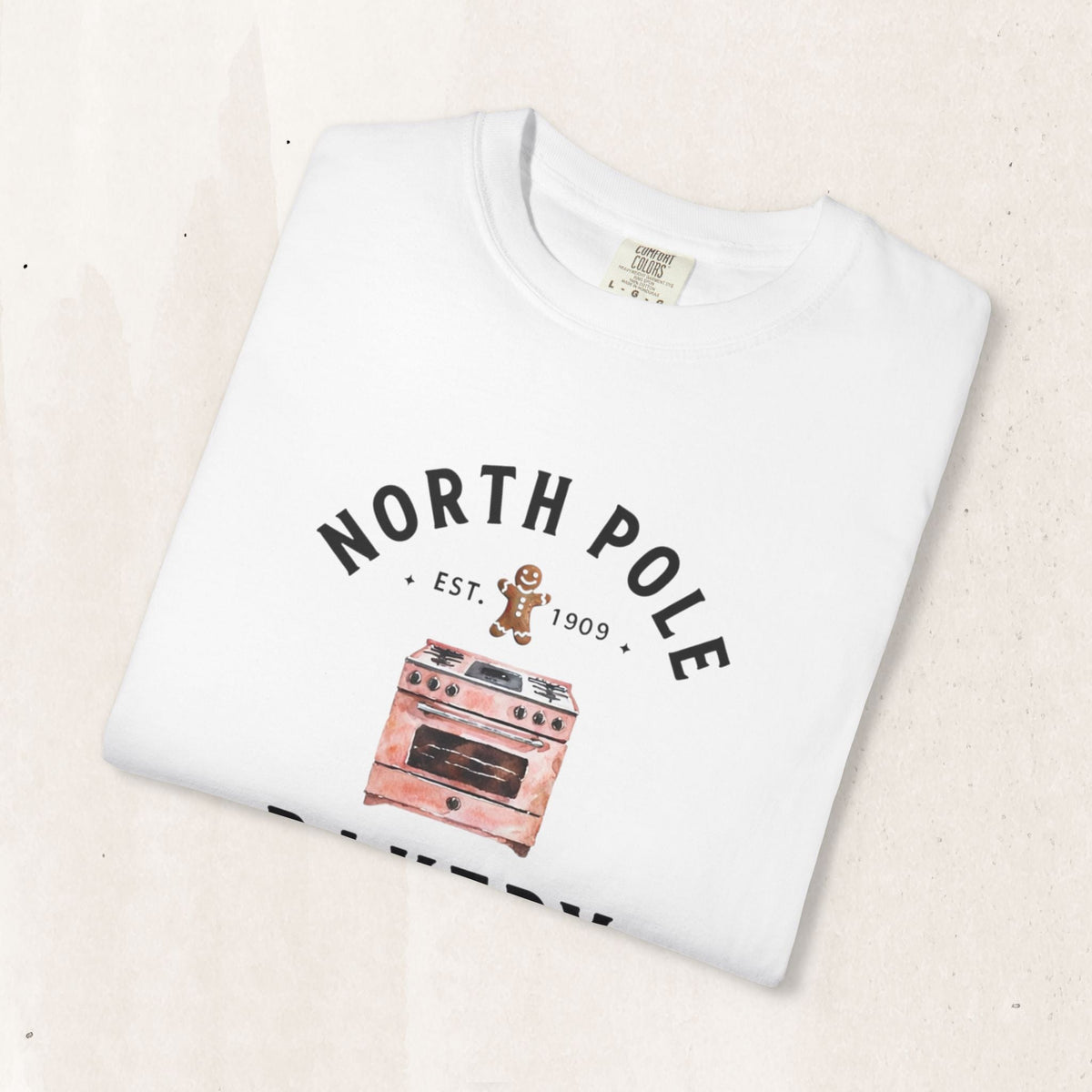 Wicked Thread Society white heavyweight cotton Christmas t-shirt with a vintage North Pole Bakery oven graphic.