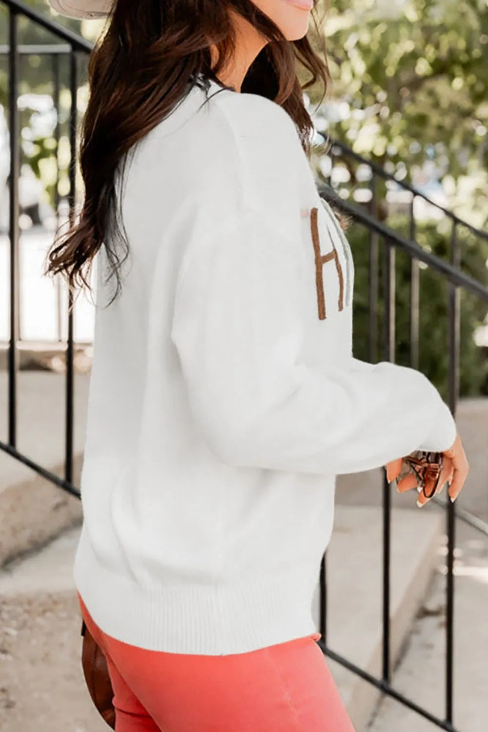 Wicked Thread Society white THANKFUL round neck drop shoulder sweater with brown lettering worn by a woman outdoors