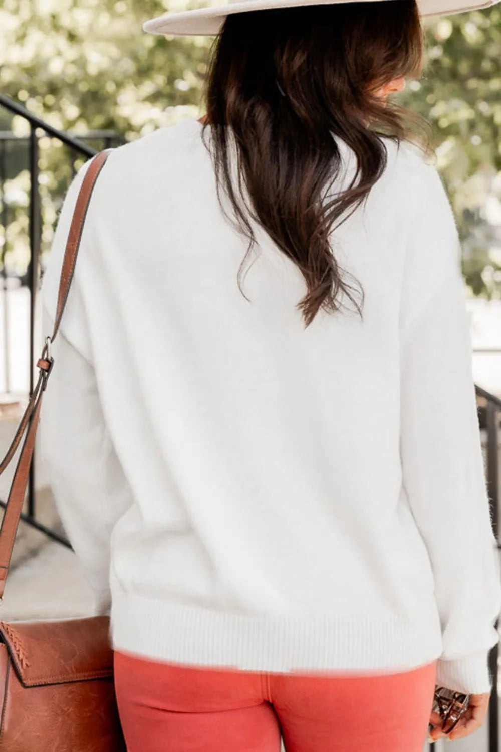 Wicked Thread Society white round neck drop shoulder sweater worn by a woman with a brown crossbody bag