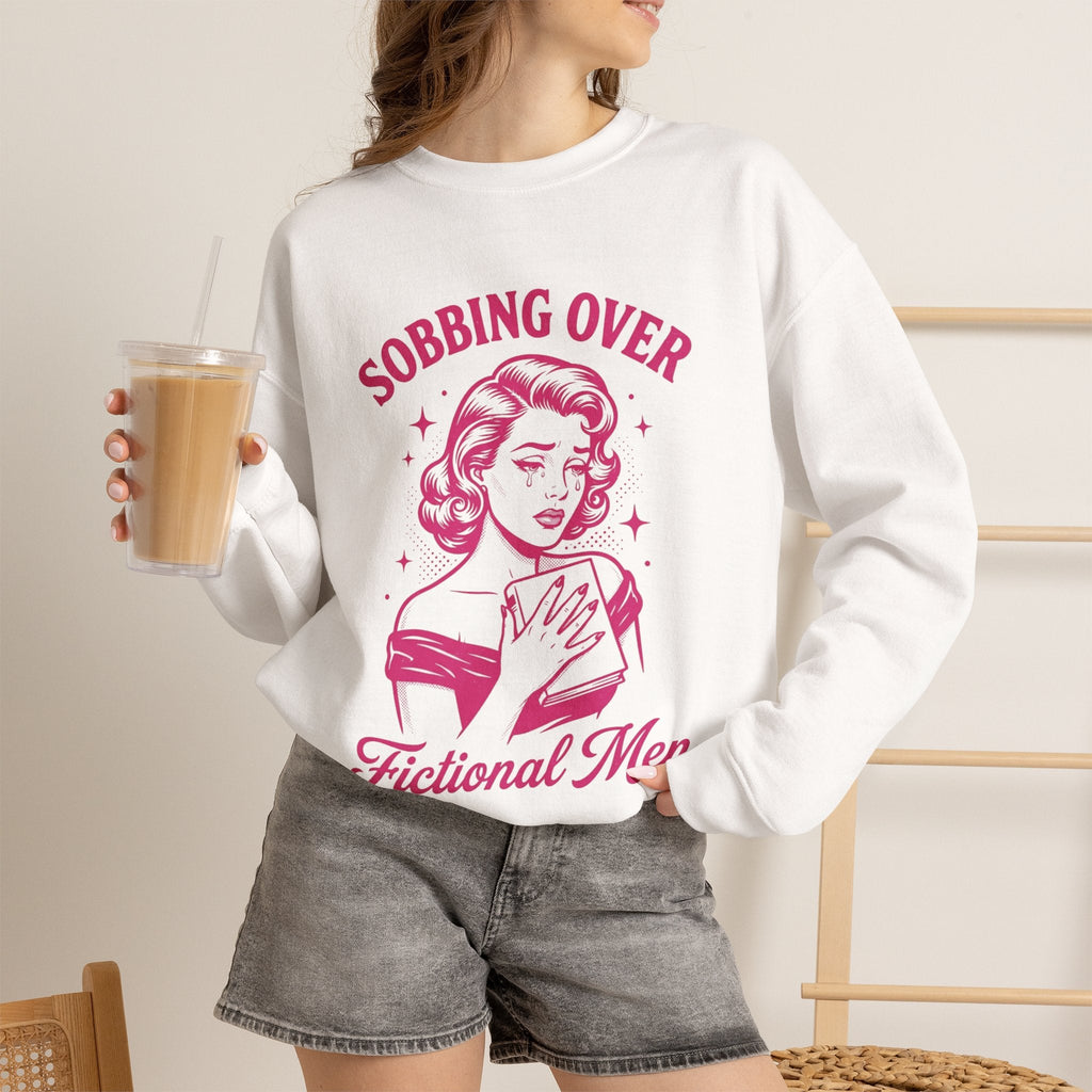 Wicked Thread Society white crewneck sweatshirt with a retro pink graphic of a woman crying while reading a book.