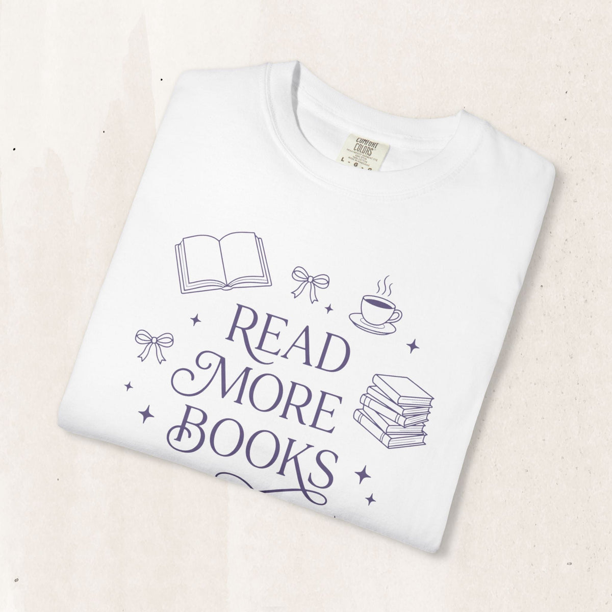 Wicked Thread Society white cotton graphic tee featuring a Read More Books illustration with a book and coffee cup.