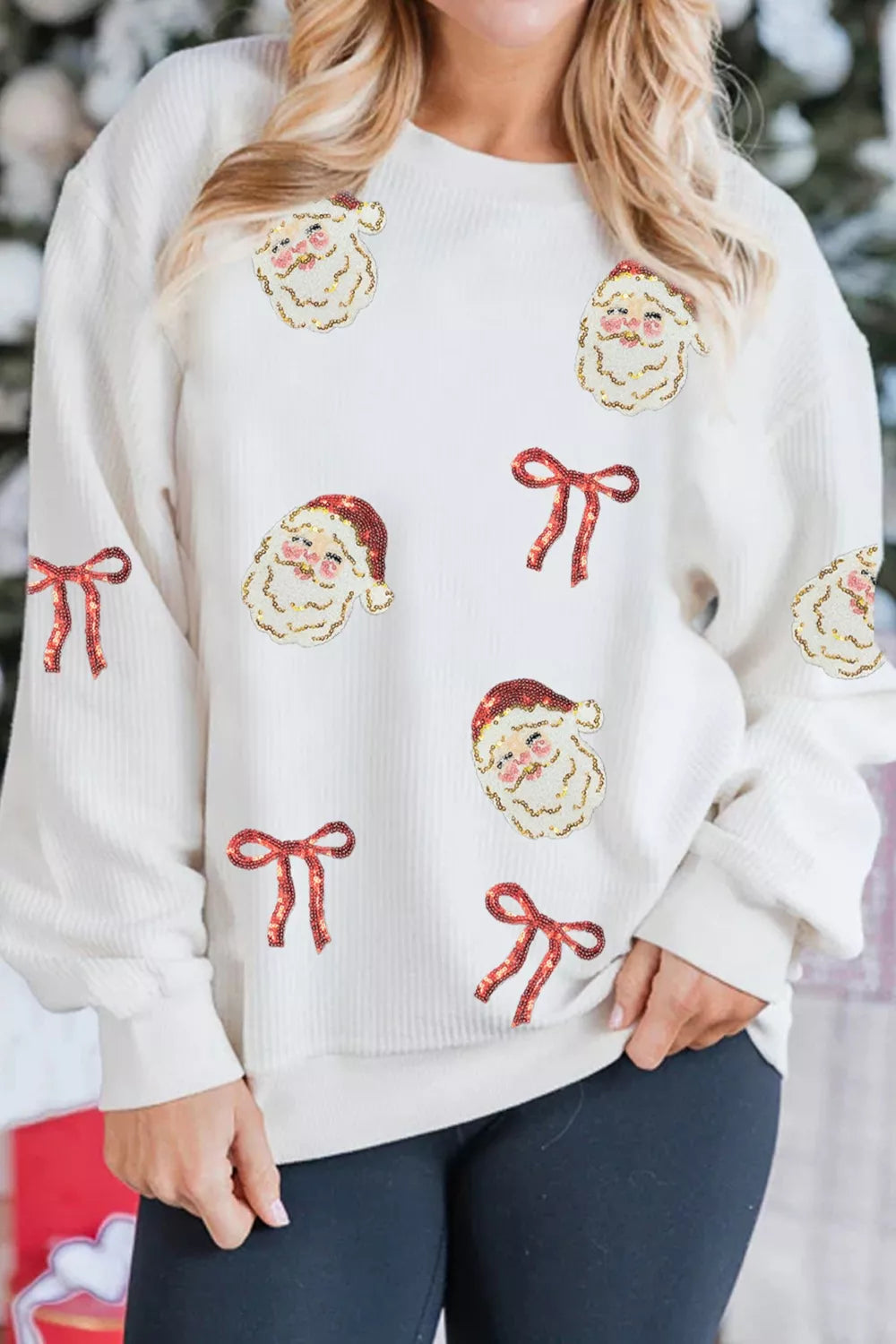 Wicked Thread Society white corded rib sweatshirt featuring festive sequin Santa face and red bow patches.