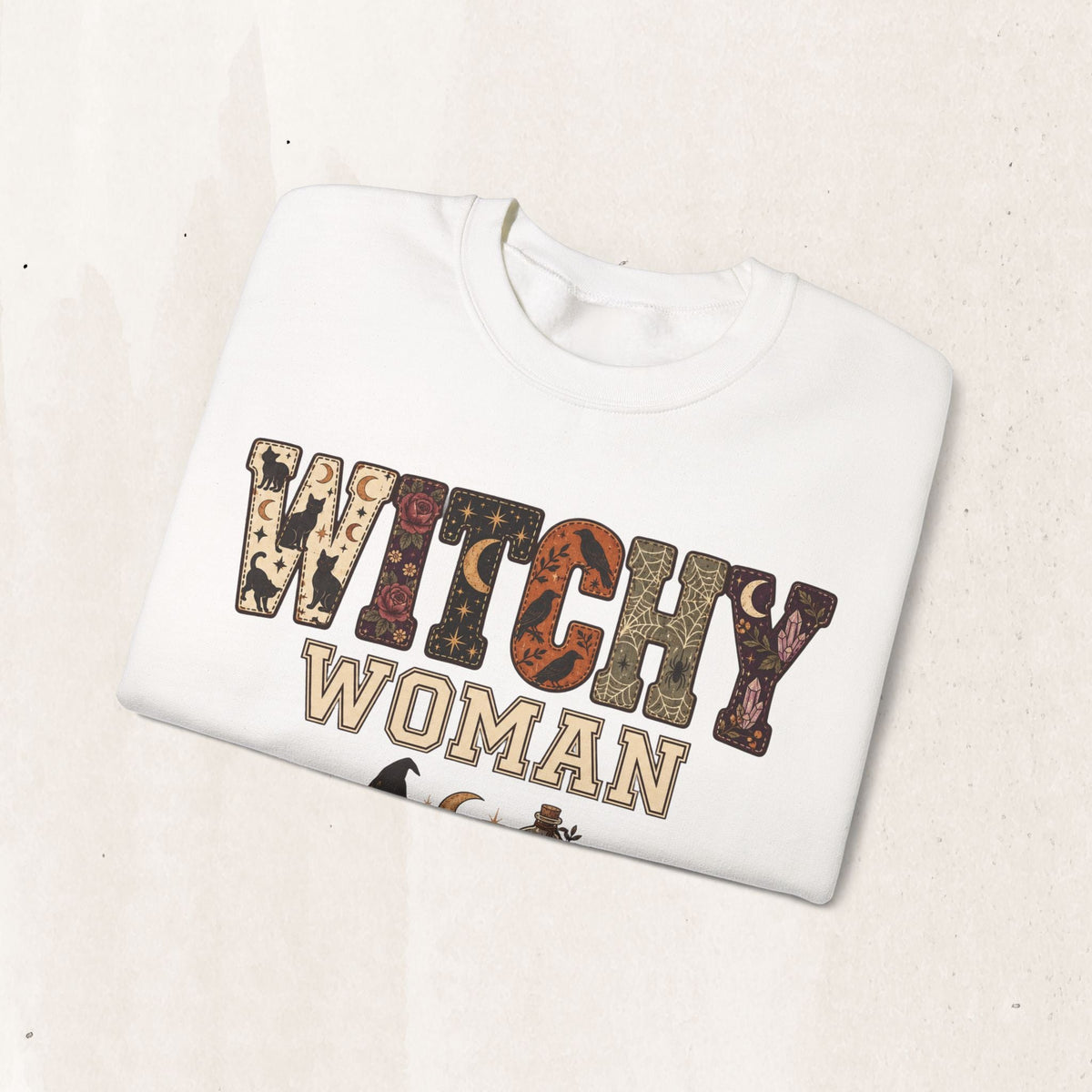 Wicked Thread Society white crewneck sweatshirt featuring a vintage-style Witchy Woman graphic with occult motifs.